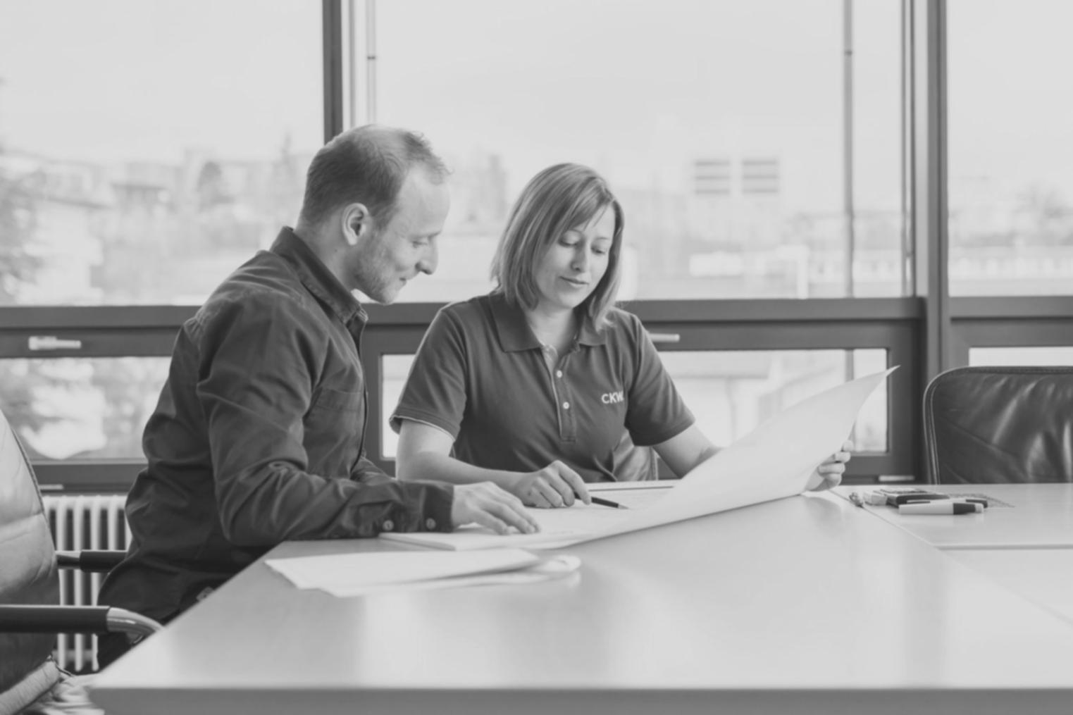 Modern office space with financial research tools and collaborative workspace